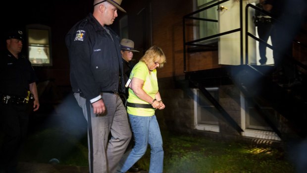 Joyce Mitchell is led into court on Friday. 