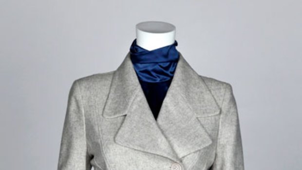 Edgy ... Arabella Ramsay jacket, $480, and skirt, $175, (03) 9824 4490 and a Nina Maya silk high-necked blouse, $289, (02) 9363 1949.