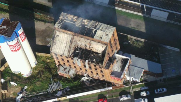 The smouldering remains of the Albion flour mill. Photo: Penny Dahl/Australian Traffic Network.
