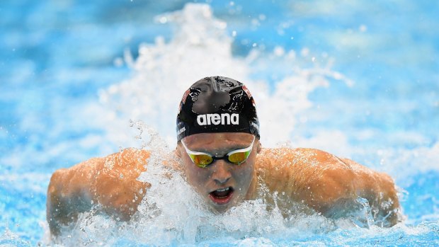 On the plane: Thomas Fraser-Holmes comes home to win the men's 400m IM.
