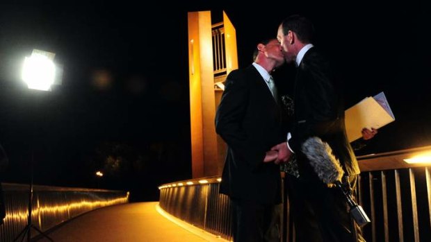 Alan Wright, left, and Joel Player celebrate becoming Australia's first same-sex married couple, at 12.01am on December 7 in Canberra.