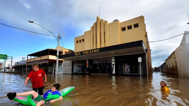 Flooding in the Charlton High Street, outside the historic Rex Theatre. <i>Picture: Justin McManus</i>