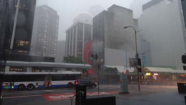 Heavy rain hits the Brisbane CBD.