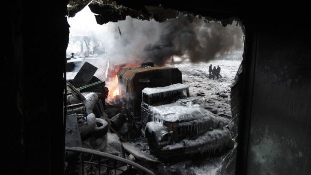 Aftermath: A burnt truck is seen at the site of clashes between anti-government protester and riot police in Kiev.