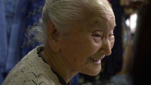 Fumi Chinene, 102, runs a clothing store. Okinawans enjoy the longest life expectancy in the world.