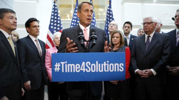 US House Speaker John Boehner stands with fellow Republican House leaders as he addresses reporters in Washington.