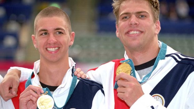 A youthful Anthony Ervin celebrates his Sydney 2000 Olympic gold medal in the men's 50m freestyle with the man with whom he dead-heated, countryman Gary Hall Jr.