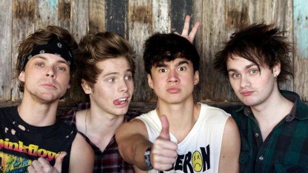 Long way from home: Australian pop rockers 5 Seconds of Summer, (from left)  Luke Hemmings, Ashton Irwin, Calum Hood and Michael Clifford, had fans waiting for seven hours at the London iTunes Festival.