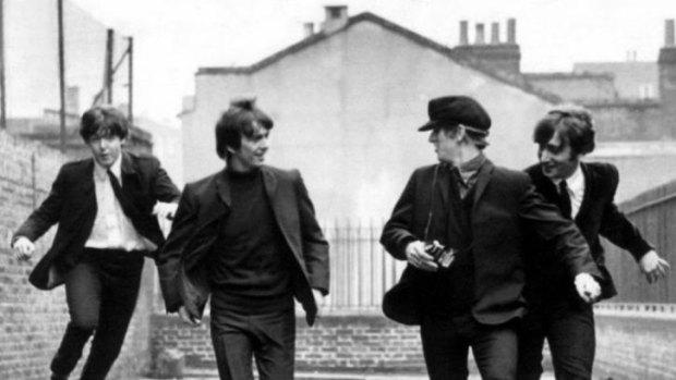 On the run: The Beatles during filming of  <i>A Hard Day's Night</i> (1964).