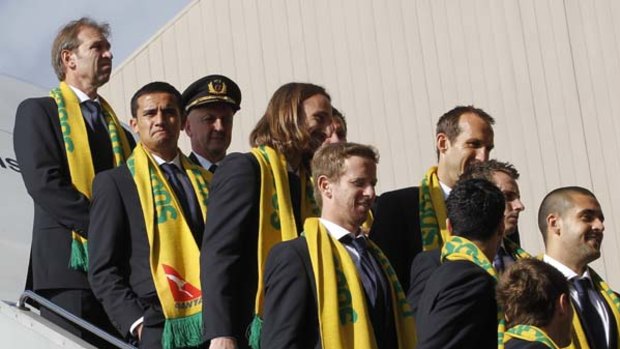 Boarding call . . . the Socceroos left Melbourne for South Africa yesterday. A fitness cloud hangs over several squad members.