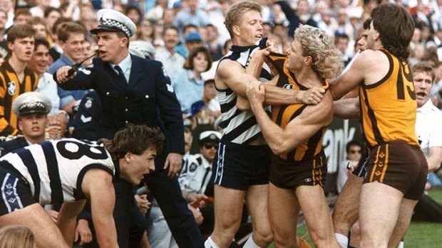 Geelong's Steve Hocking and Hawthorn's Dermott Brereton come to grips in one of several angry exchanges during the '89 grand final.