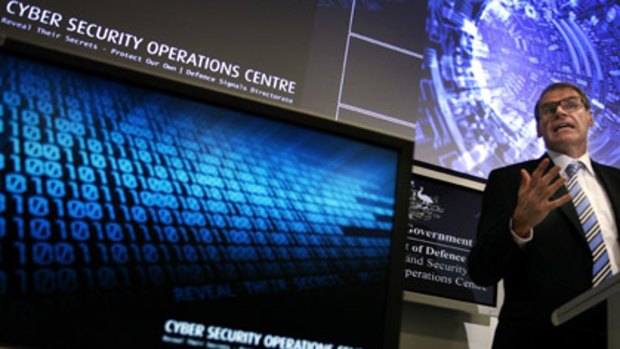 Minister for Defence, Senator John Faulkner officially opens the Defence's new Cyber Security Operations Centre in Canberra in January, 2010. Photo: AAP Image/Stefan Postles