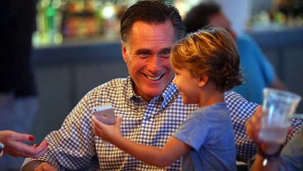 A grand relationship ... the Republican presidential candidate, Mitt Romney, plays with his grandson Parker Romney in Florida the day before the final debate.