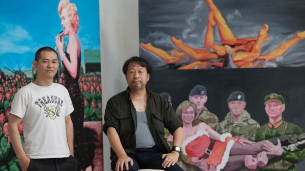 Chinese-Australian artists Guo Jian (left) and Shen Jiawei with Guo's work in Guo's Beijing studio.