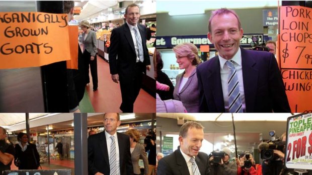 Out and about ... Tony Abbott visits Canberra businesses yesterday. The government has tried to link Mr Abbott to climate change sceptic Lord Monckton.