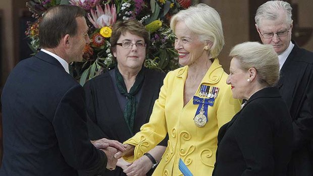 Governor-General Quentin Bryce shakes the hand of Prime Minister Tony Abbott as Speaker Brownwyn Bishop watches on.
