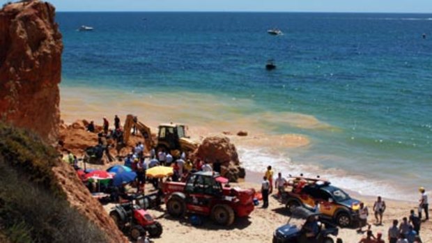 Tragedy...rescue workers search for survivors at Maria Luisa beach in Southern Portugal.