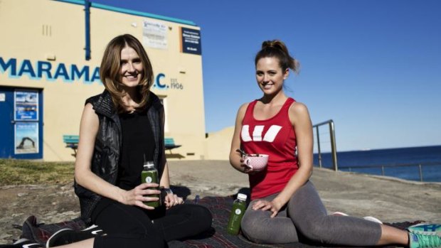 Picnic time: Jesinta Campbell, right, and Kate Waterhouse have a picnic outside Tamarama Beach Surf Club.