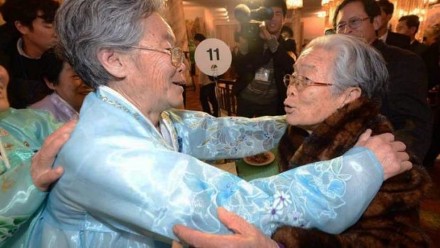 North Korean Kim Seok-Ryeo, 80, greets her South Korean sister Kim Sung-yun on Thursday.