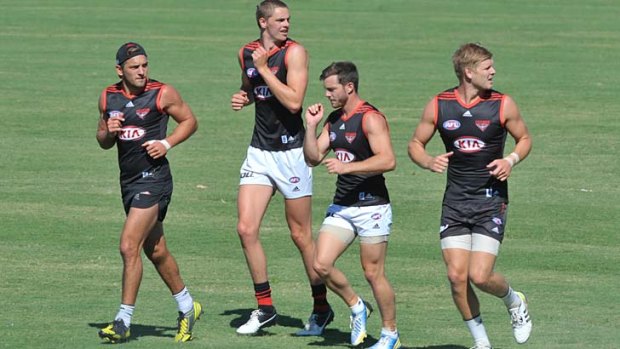 Under the microscope, for all the wrong reasons: Essendon players at training at Tullamarine on Wednesday.
