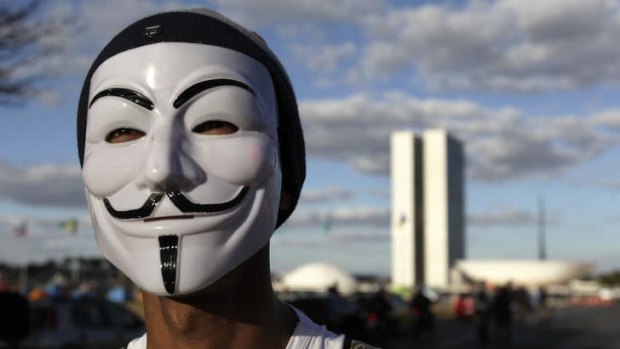 A demonstrator wearing a Guy Fawkes mask attends a protest in Brasilia.