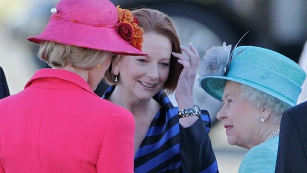 Governor-General Quentin Bryce and Prime Minister Julia Gillard chat with Her Majesty after touching down in Canberra.