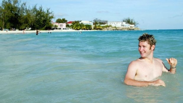 Pup at play: Michael Clarke enjoys Barbados in 2003.