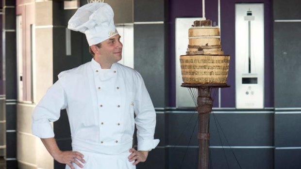 Sweet: Lindt Australia's maitre chocolatier Thomas Schnetzler with a chocolate replica of Sydney Tower.