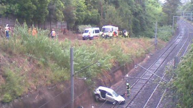 A reader's picture of the car lying across the tracks.