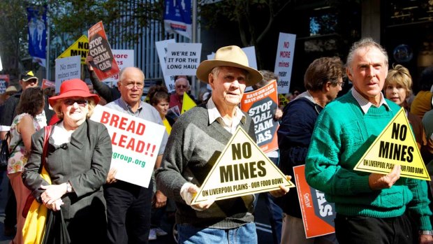 Environmentalists and farmers rally against coal seam gas mining outside State Parliament.