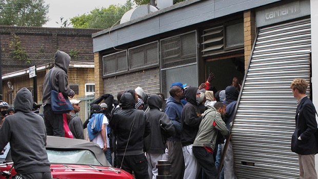 Youths loot a Carhartt store in Hackney.