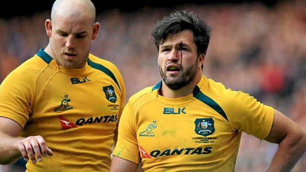 Battered: Adam Ashley-Cooper during the loss against England.