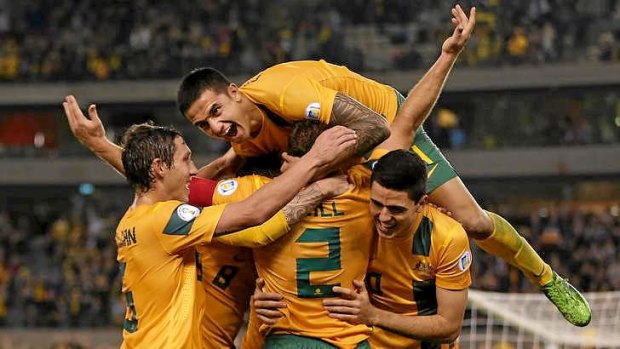 Tim Cahill and his teammates celebrate a goal during the qualifier against Jordan.