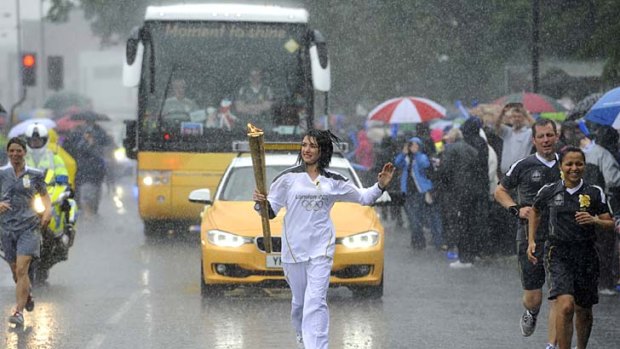 Drenched ... Olympic torchbearer Gemma Flaxman.