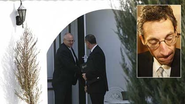 Search over ... Australian Federal Police leave Godwin Grech's home in Canberra.