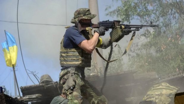 A Ukrainian serviceman shoots during fighting with pro-Russian separatists in the eastern Ukrainian town of Ilovaysk.