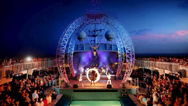 Pacific Cirque perform their open-air circus high above the pool deck.