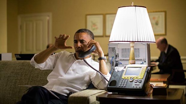 Telephone diplomacy &#8230; President Obama in his Phnom Penh hotel room.