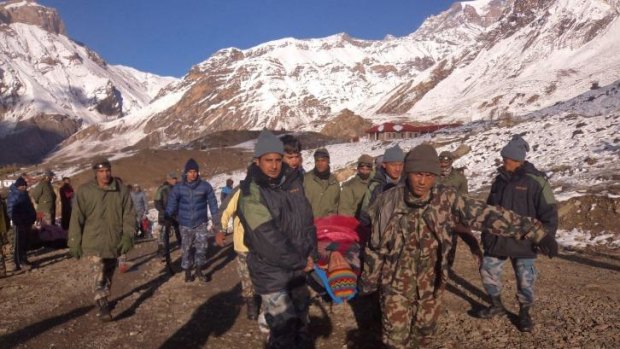 An injured hiker evacuated by Nepal Army soldiers in Manang District, along the Annapurna Circuit hiking trail. 