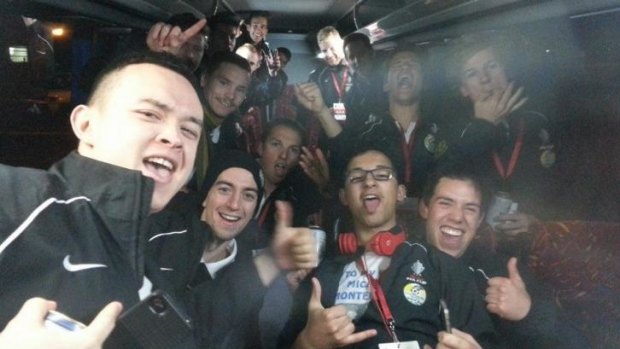 Tuggeranong United players party on the team bus after their FFA Cup win over South Hobart.