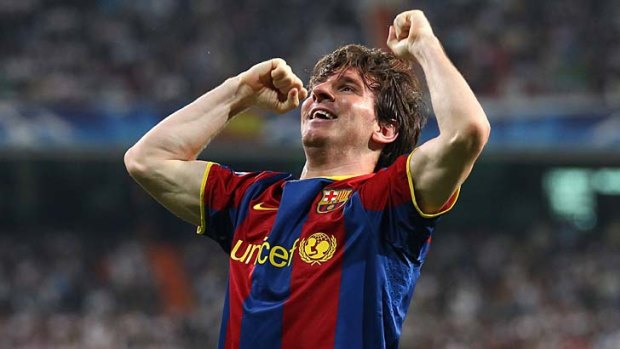 Lionel Messi of Barcelona celebrates after scoring his first goal during the UEFA Champions League Semi Final first leg.