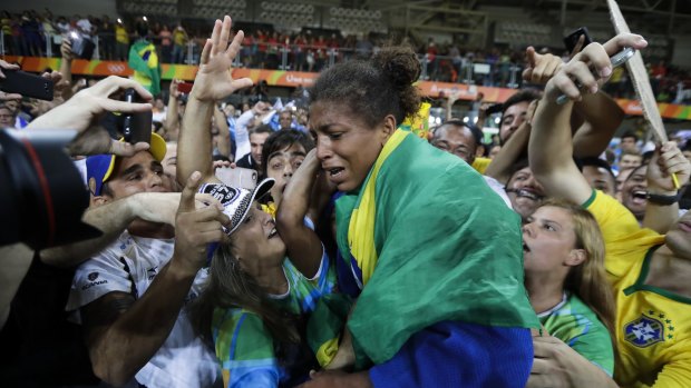 Silva ran to the stands to embrace her family members after winning the gold. 