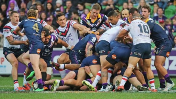 Storm and Roosters players brawl during the round 13 NRL match between the Melbourne Storm and the Sydney Roosters at AAMI Park.