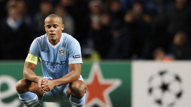 Manchester City's Vincent Kompany reacts after being knocked out of the Champions League.
