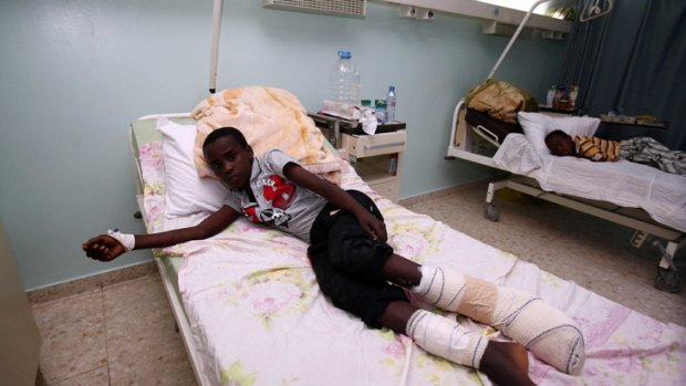Patients wounded in tribal clashes in the south recuperate in hospital in Tripoli.