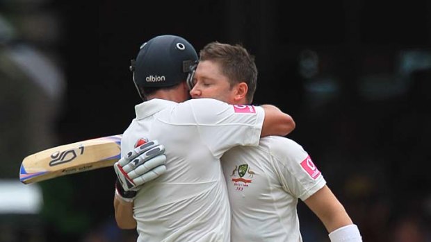 Achievement overshadowed: Michael Hussey embraces Michael Clarke after the latter reached 300.