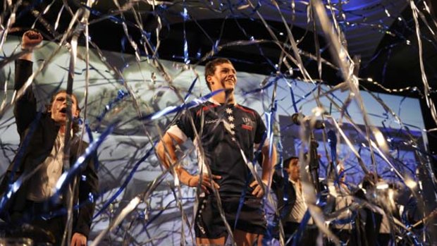 Stirring sight . . . Luke Jones unveils the Melbourne Rebels jersey amid much hoopla at Crown Casino on Thursday.