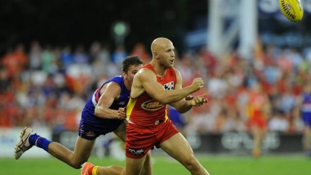 Gary Ablett of the Suns handballs during the round 10 AFL match between the Gold Coast Suns and the Western Bulldogs.