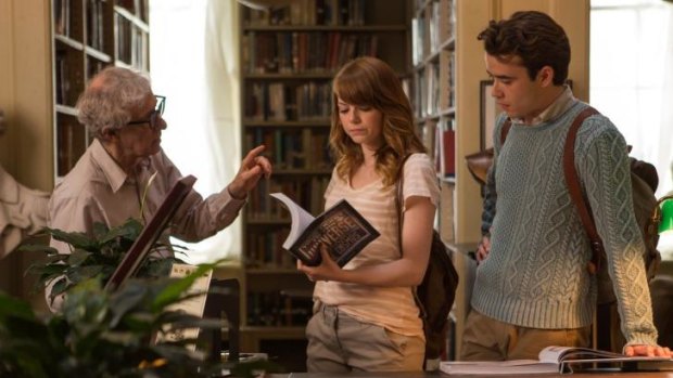 Director Woody Allen on set with Emma Stone and Jamie Blackley.