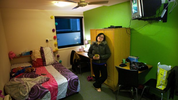 Chef Josephine Lee, 37, in her 'micro apartment' in Flinders Street. She pays $300 a week for 11.2 square metres of living space.